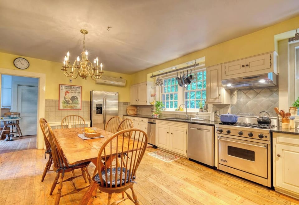 The kitchen is fully equipped with high-quality cookware, utensils, and all the essentials for preparing meals with ease — highlighted by a professional-grade Viking stove for the culinary enthusiast.