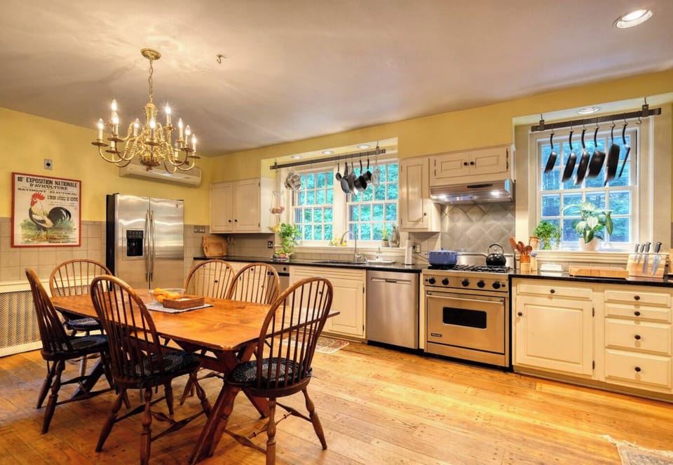 The kitchen is fully equipped with high-quality cookware, utensils, and all the essentials for preparing meals with ease — highlighted by a professional-grade Viking stove for the culinary enthusiast.