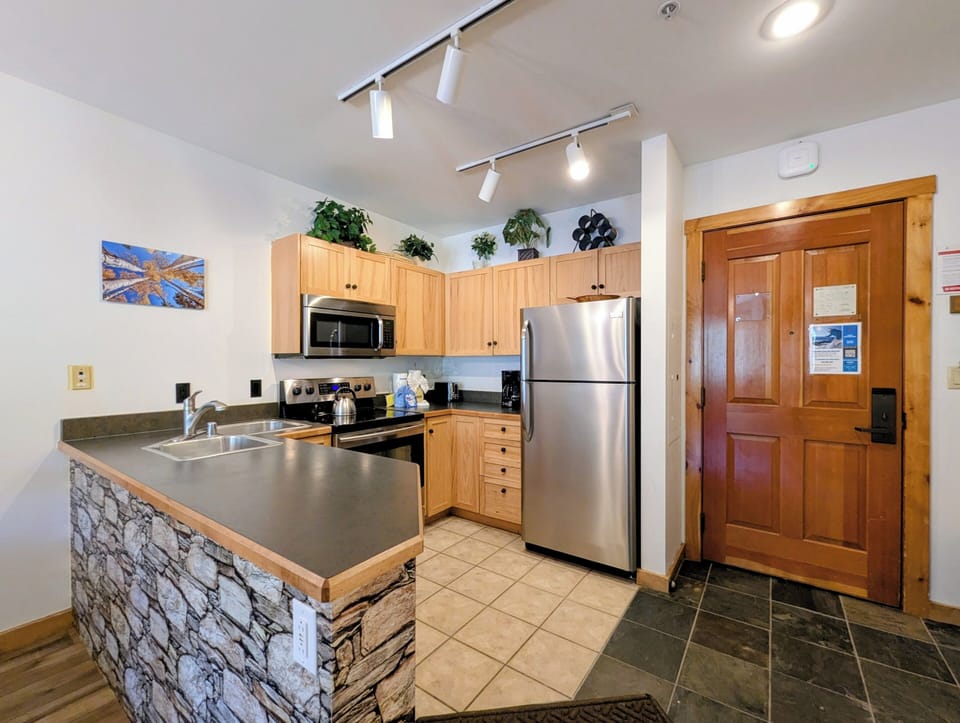 Your fully equipped kitchen makes meal prep a breeze with stainless appliances, ample counter space, and everything you need to cook up something delicious.