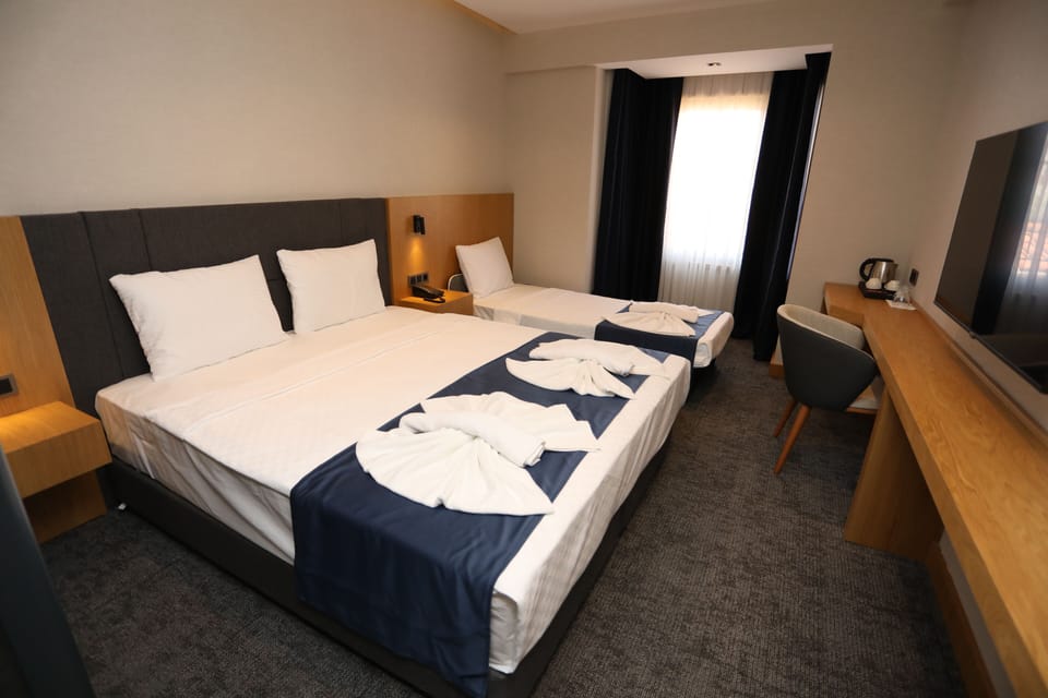 Superior Triple Room, City View | Minibar, in-room safe, laptop workspace, WiFi (free)