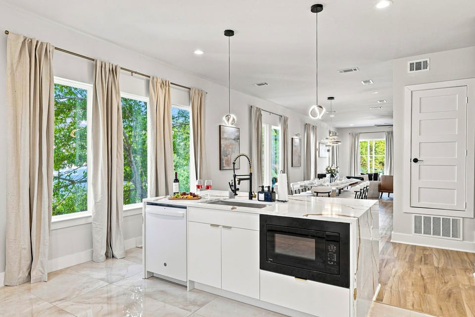 Sunlit space with modern appliances and stunning views, perfect for culinary adventures!
