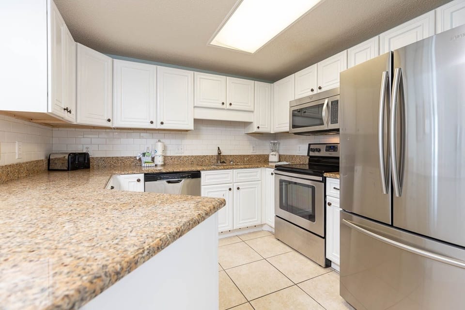Condo, 2 Bedrooms | Private kitchen | Coffee/tea maker, fridge, oven