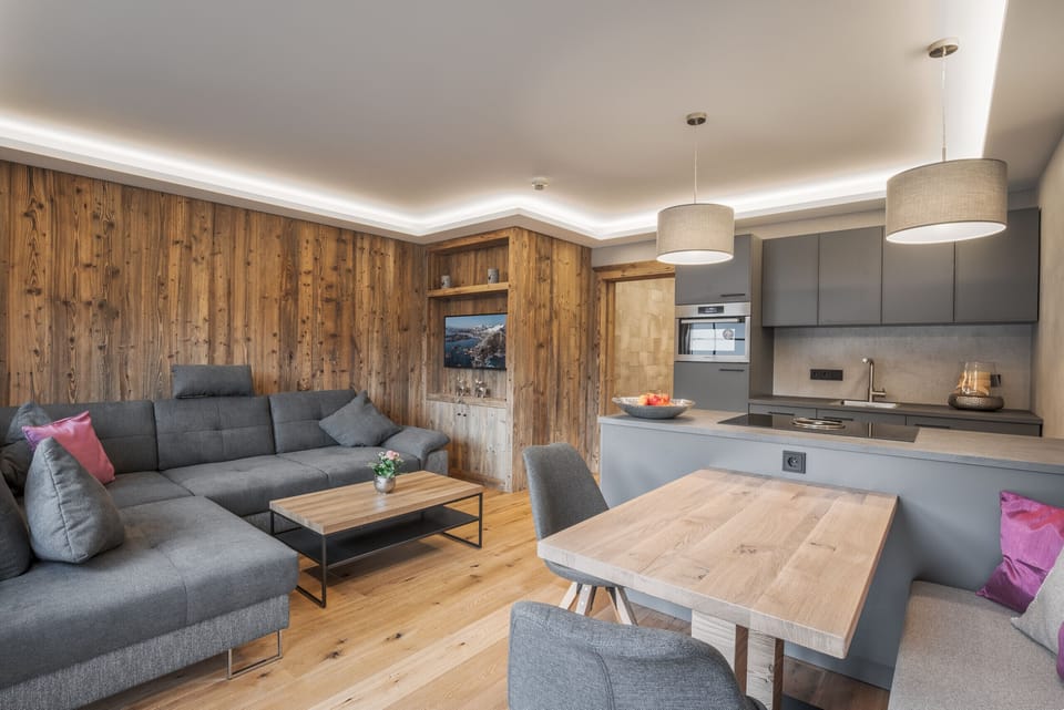 Open living and kitchen area in the Premium Apartment, stylishly furnished and central for skiing, hiking and biking vacations.
