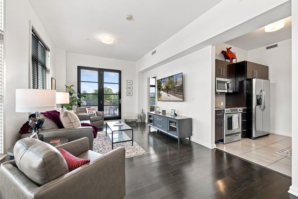Living room featuring a smart TV, cozy seating, and board games!