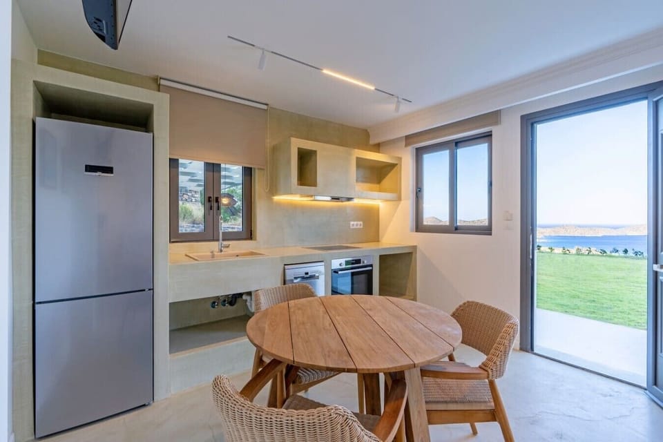 Bright, open-plan kitchen stocked with everything you need for homemade meals.