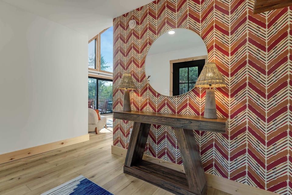 Warm light, bold pattern — a little flair right where you first arrive.