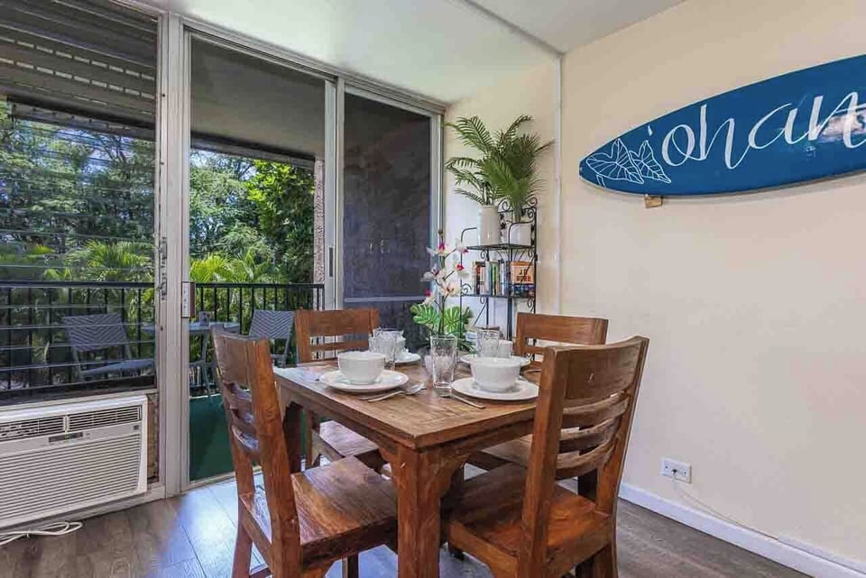 Share island-inspired meals at your private dining table, where tropical breezes drift through open doors.
