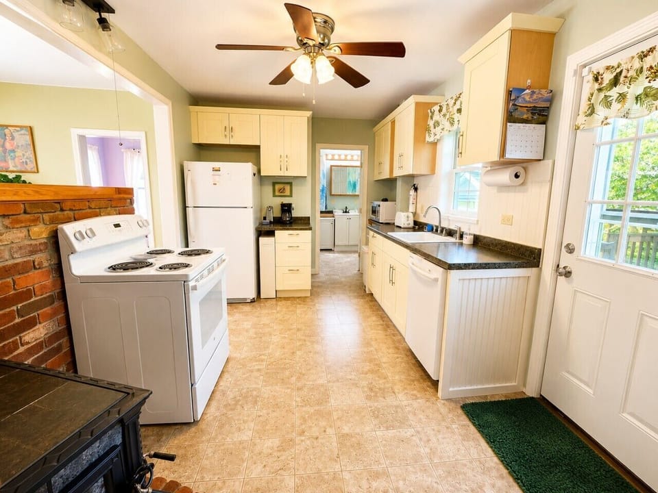 Bright, fully equipped kitchen with plenty of counter space and everything needed for easy meal preparation.