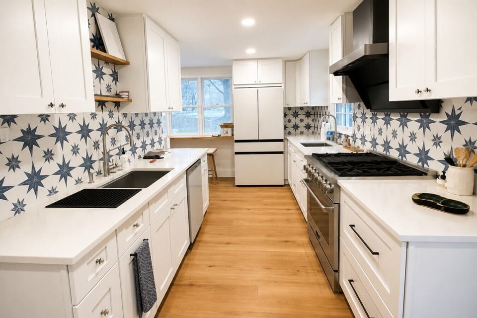 Fully stocked kitchen as you walk through the side entrance. Bowl will be on the counter with garage door opener for trash and recycling. Sink on the left has a composter, and second sink on the right has instant hot water for tea.