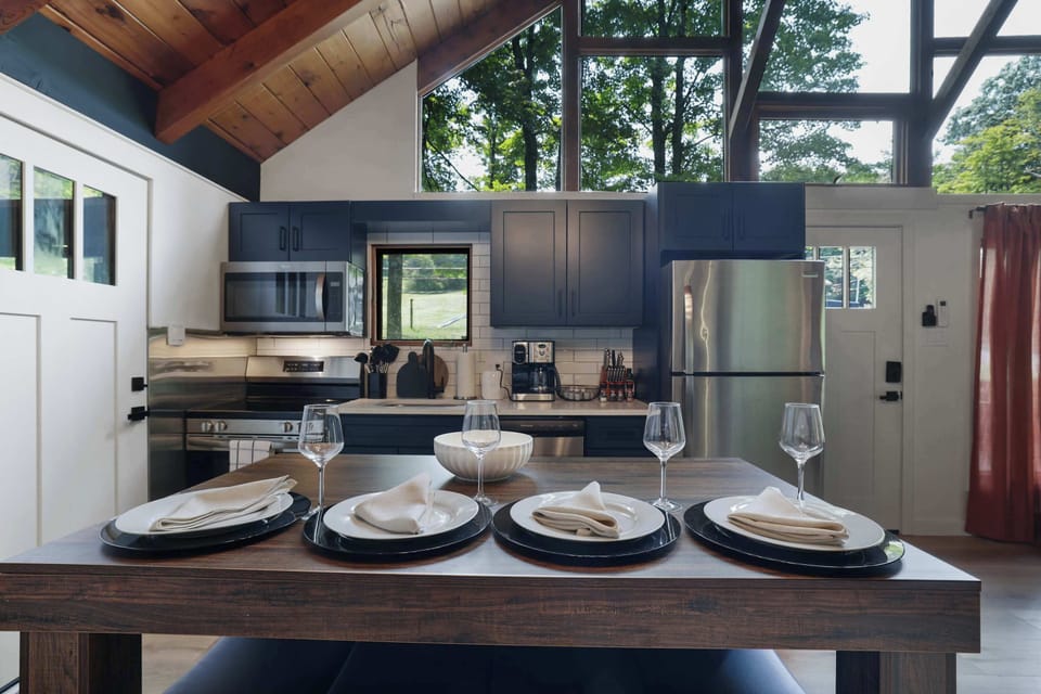 Vaulted wood ceilings and a beautifully set table make every meal here feel like an occasion, whether it is a quick breakfast or a full group dinner.
