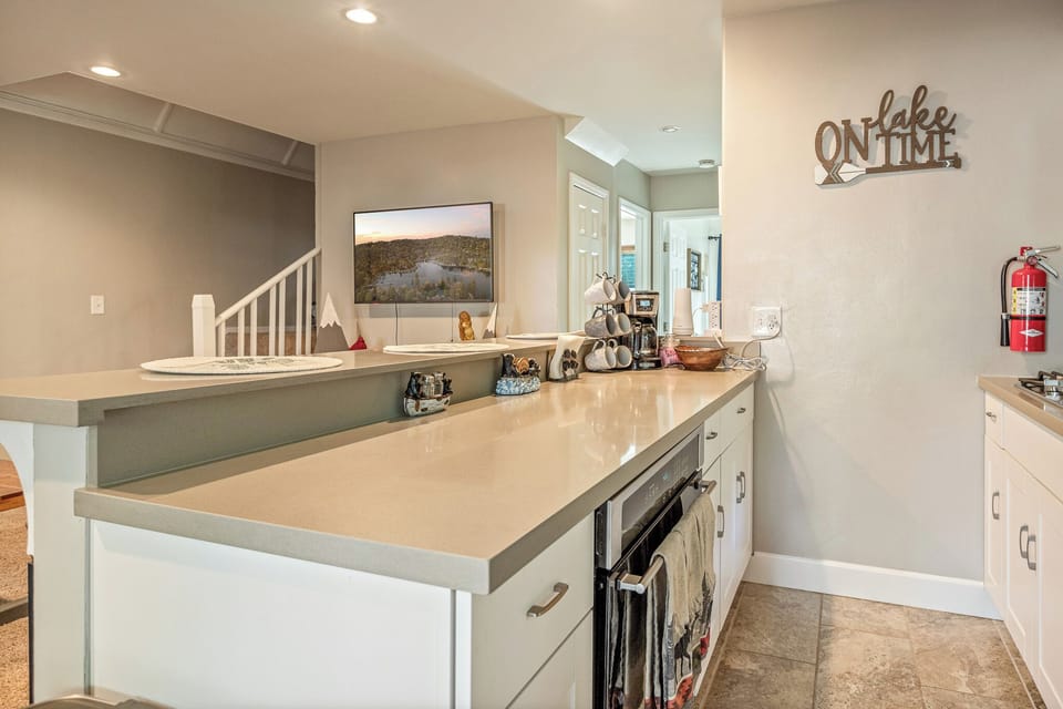 Bright lake-themed kitchenette with generous counter space and storage