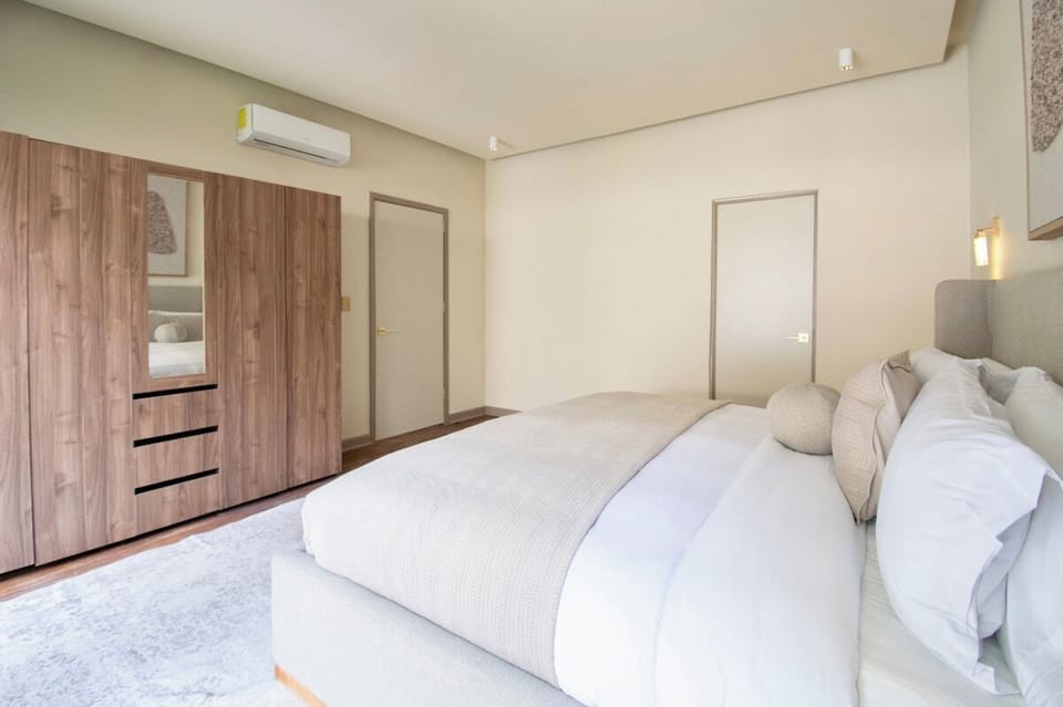 Stay comfortable year-round with air conditioning and generous closet space for keeping belongings organized. Warm wood accents and a softly layered interior complete this practical yet elegant private retreat.