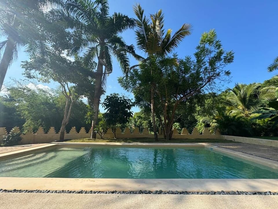 Large pool in garden area.