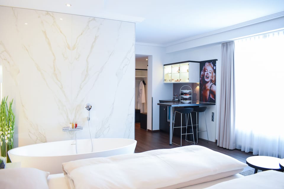 Deluxe Double Room | Living area | 80-cm LCD TV with satellite channels