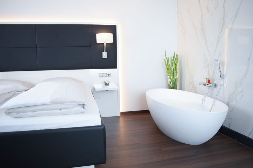 Deluxe Double Room | Living area | 80-cm LCD TV with satellite channels