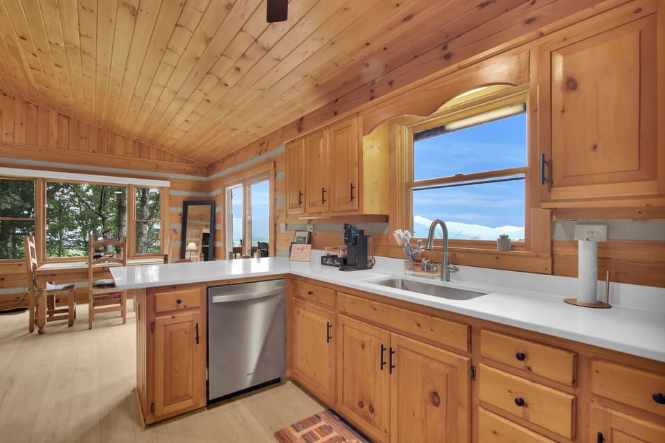 Kitchen with views, K-cup coffee maker, and granite counter tops.
