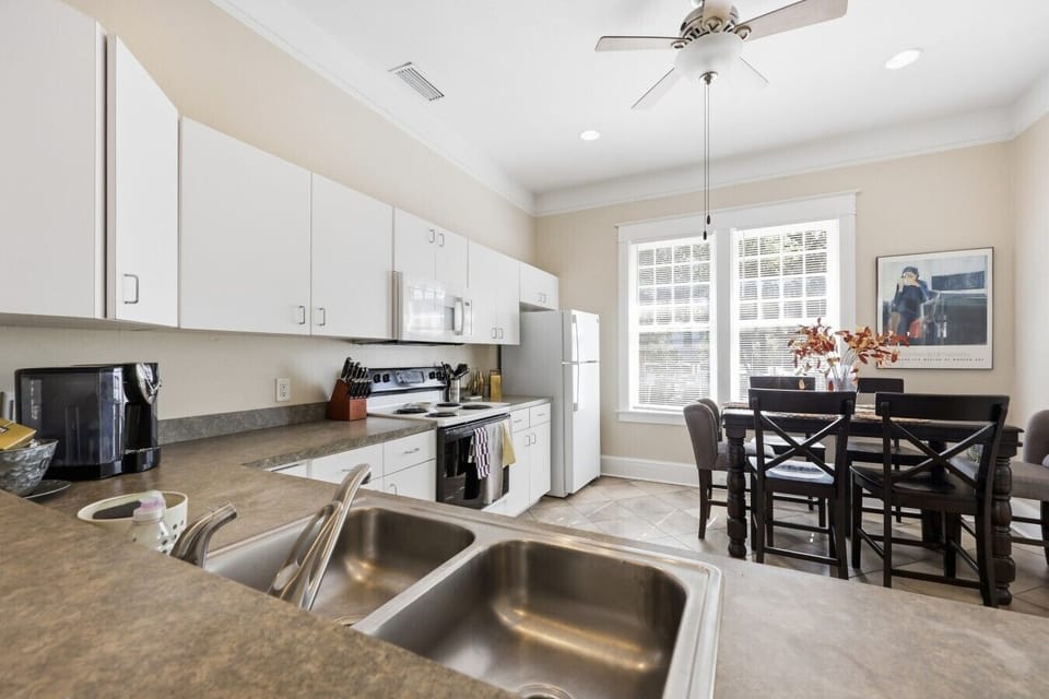 Spacious kitchen with generous counter space and dining area for group meals.