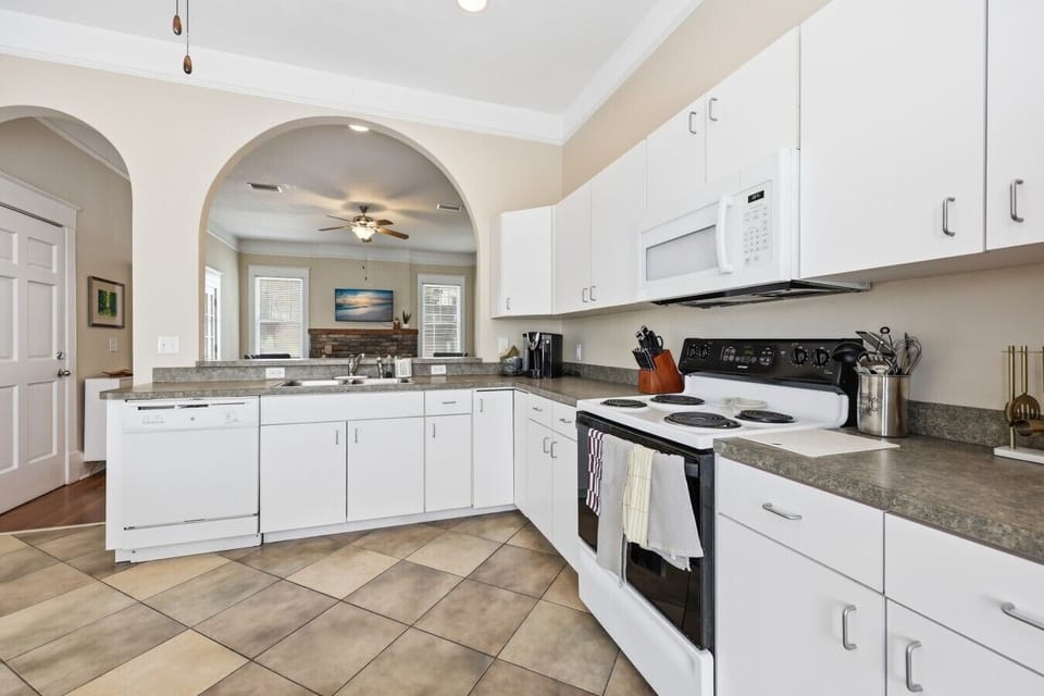 Fully equipped kitchen with abundant cabinetry and plenty of room to prepare meals.