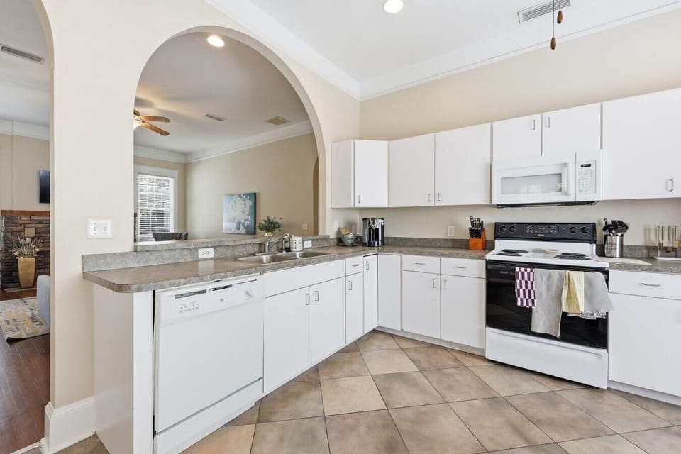 Bright, open kitchen with ample prep space and easy flow into the living areas.