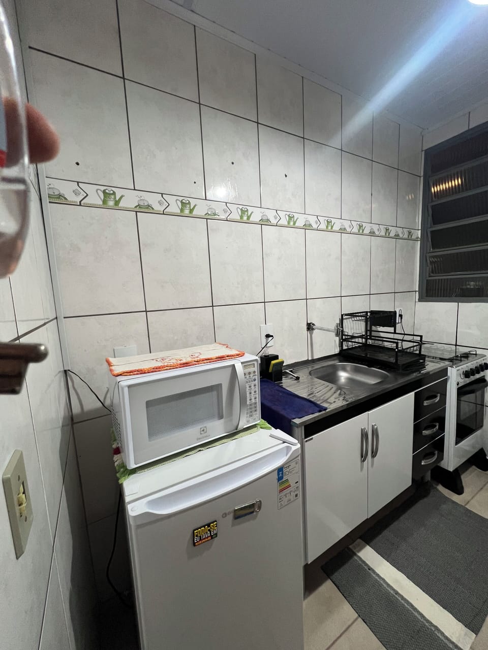 Mini-fridge, microwave, stovetop, cookware/dishes/utensils
