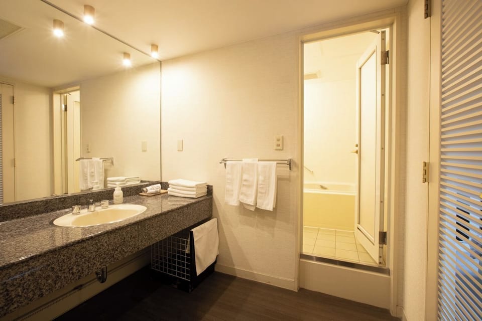 Superior Family Group Room | Bathroom | Combined shower/tub, deep soaking tub, free toiletries, hair dryer