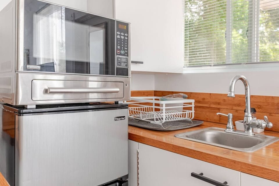 Warm your food in the microwave or store takeouts in the mini fridge.