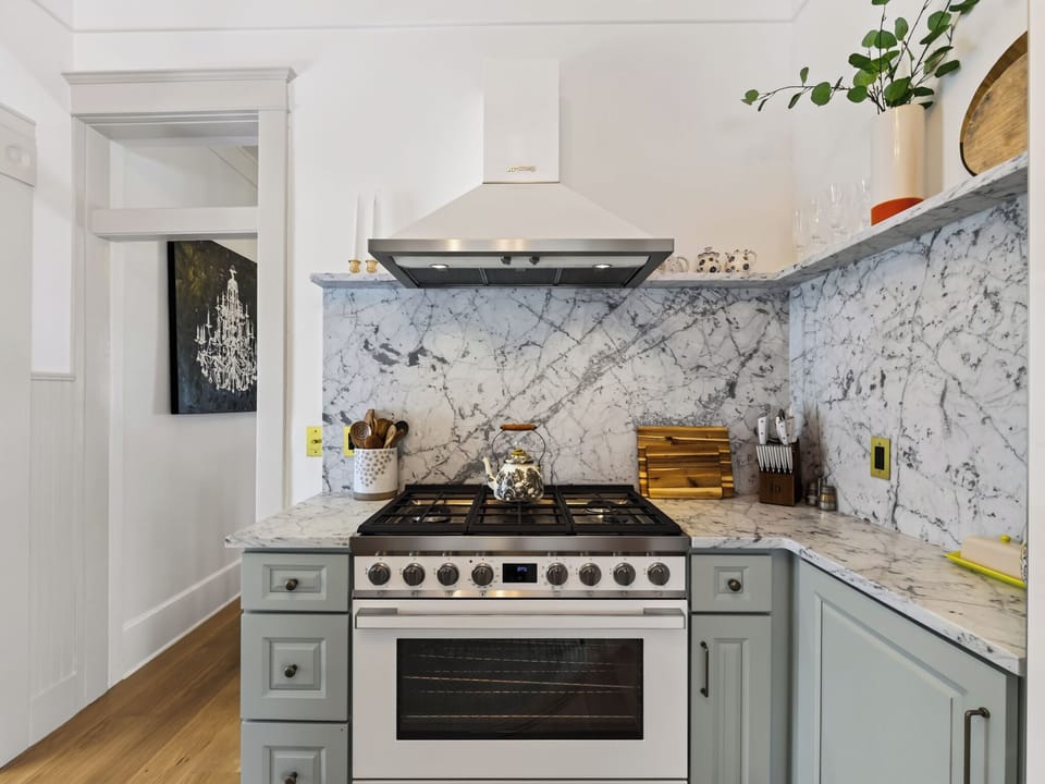 A chef's dream with modern appliances and elegant finishes designed for both functionality and style. The kitchen seamlessly connects to dining and living spaces, creating an open concept perfect for gathering. Spacious countertops provide ample preparation space, while quality cabinetry and fixtures offer convenience.