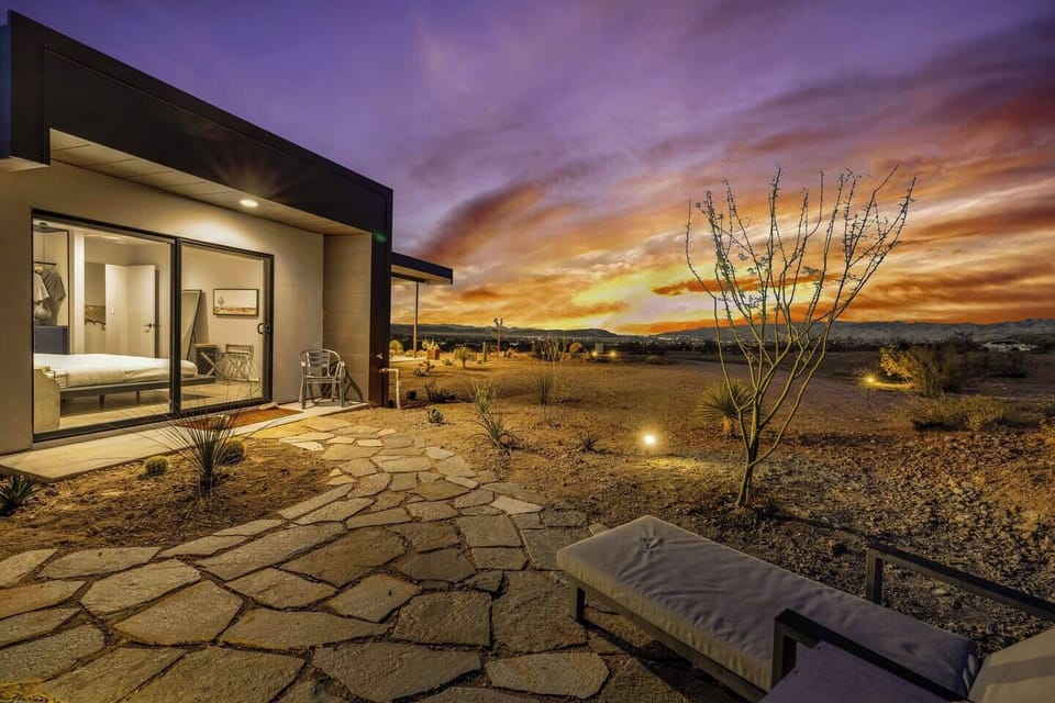 Private desert patio with glowing sunset views and modern indoor-outdoor style