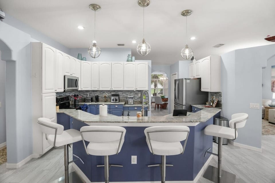 Pull up a seat at the spacious kitchen island — plenty of room for casual meals and conversation.