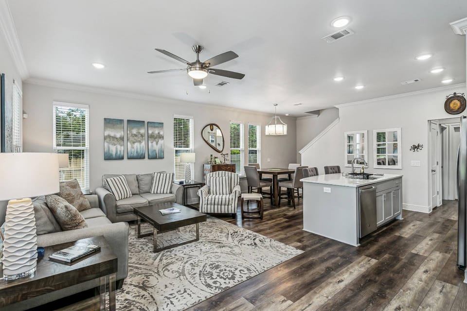 Open living room, dining area, and kitchen
