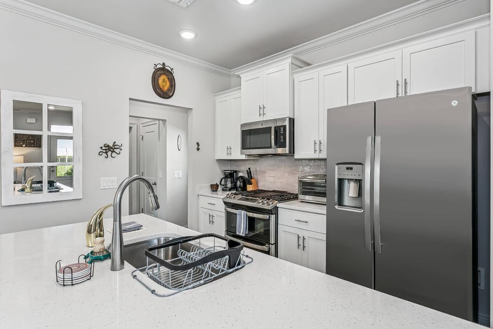 Fully equipped modern kitchen with stainless steel appliances