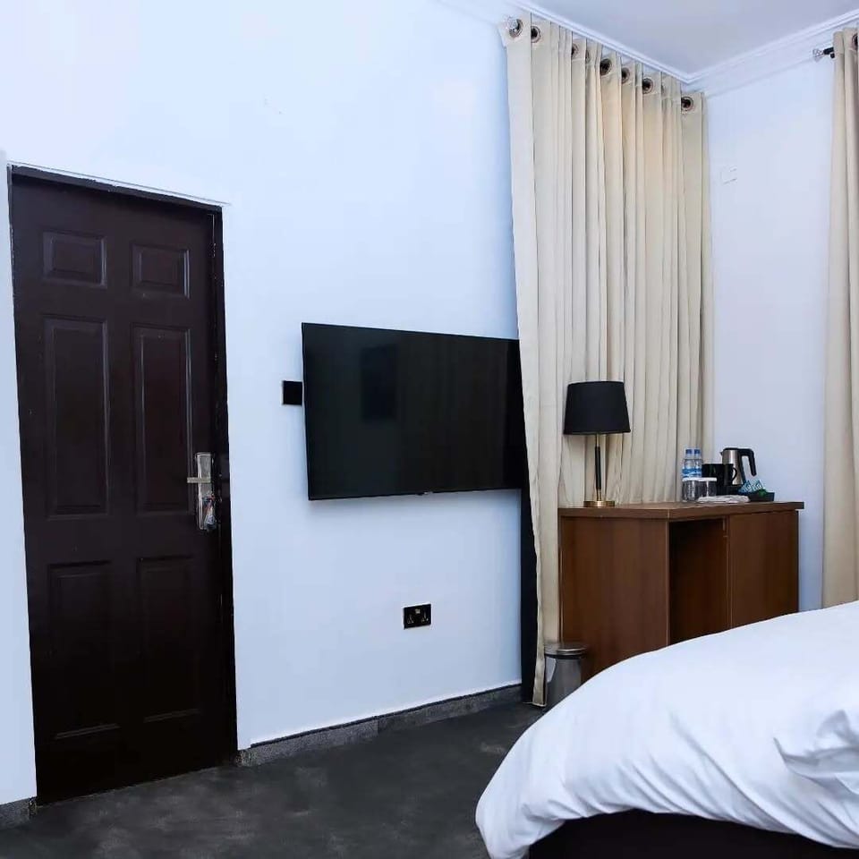Deluxe Apartment, Balcony, City View | In-room safe, desk, laptop workspace, blackout drapes