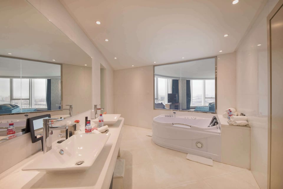 Royal Suite, 1 King Bed | Bathroom | Separate tub and shower, rainfall showerhead, free toiletries