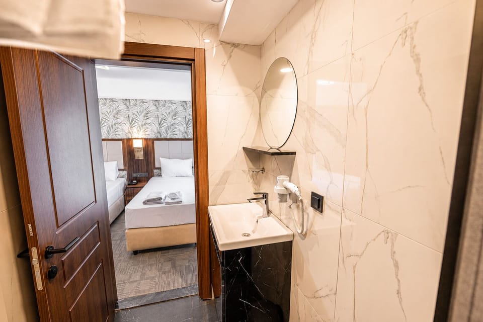 Classic Twin Room, City View | Bathroom | Hair dryer, towels, soap, shampoo