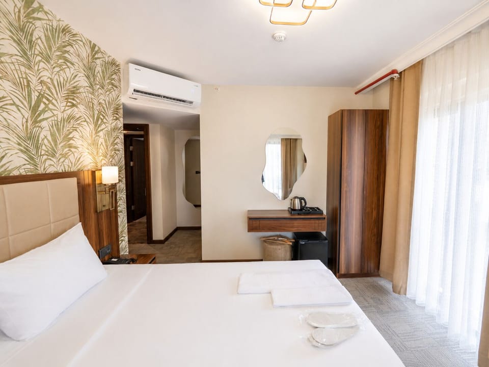 Comfort Quadruple Room, City View | Laptop workspace, WiFi (free)