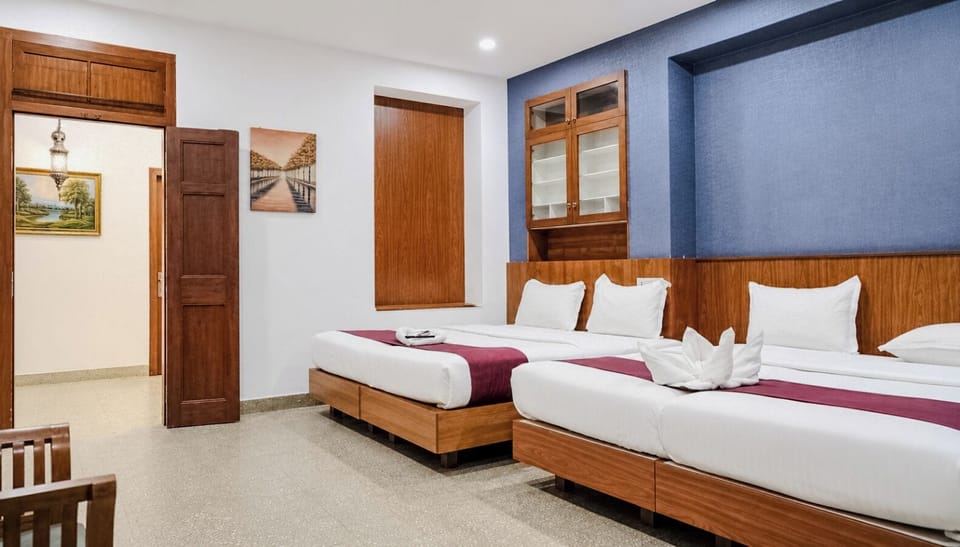 Deluxe Quadruple Room | Laptop workspace, iron/ironing board (on request), WiFi (free)