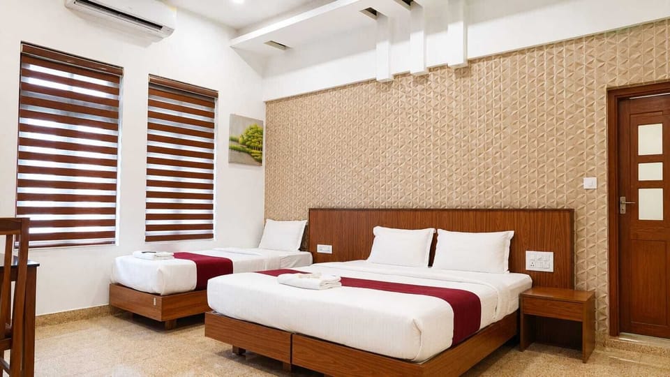 Deluxe Triple Room | Laptop workspace, iron/ironing board (on request), WiFi (free)