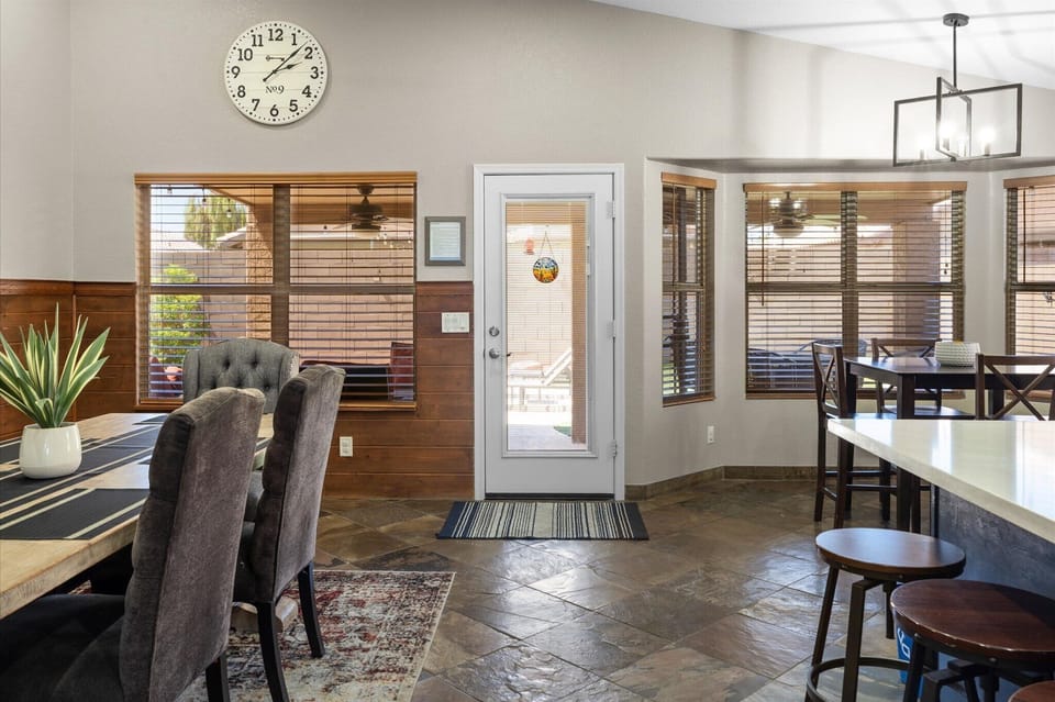 The dining and kitchen area opens directly toward the backyard for easy indoor-outdoor living.