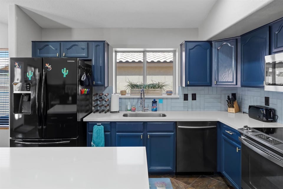 Full-size refrigerator, dishwasher, sink, and ample counter space make longer stays and group meals easy.
