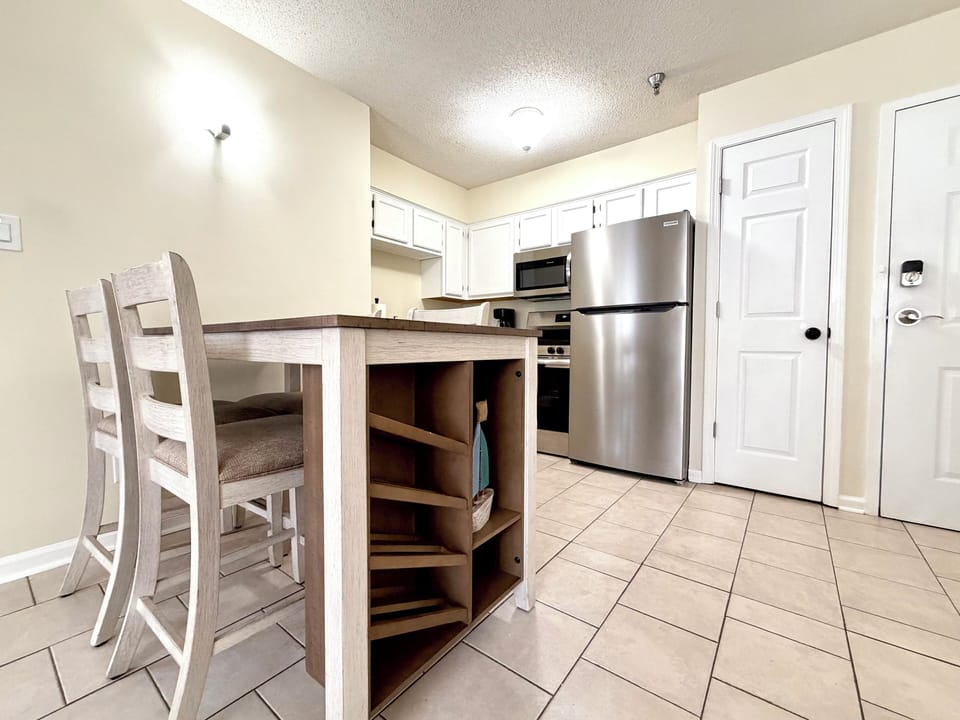 Bright kitchen with stainless steel appliances and cozy dining space