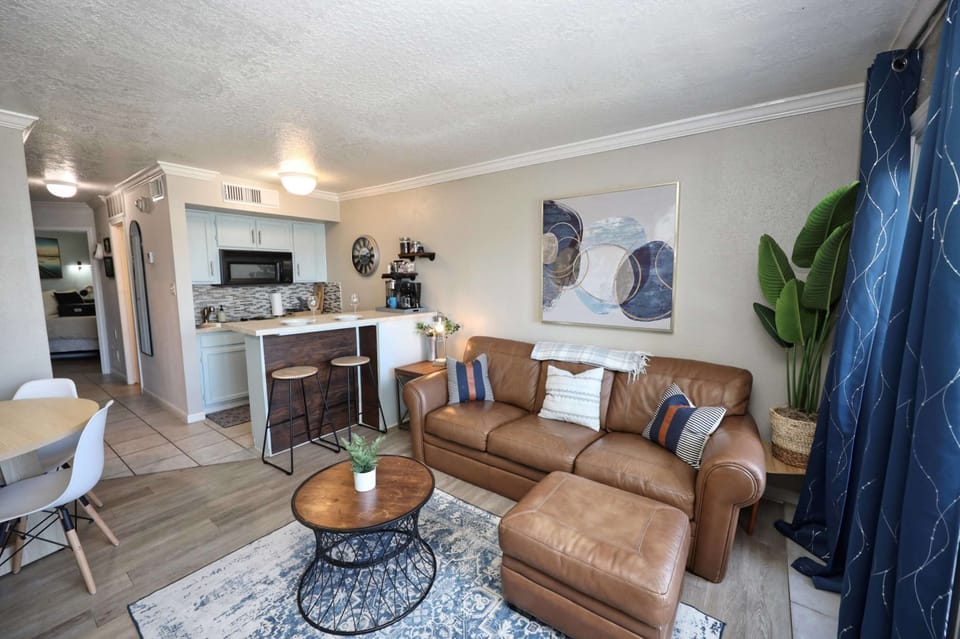 Unwind in the breezy living room & stream your favorites on the smart TV​