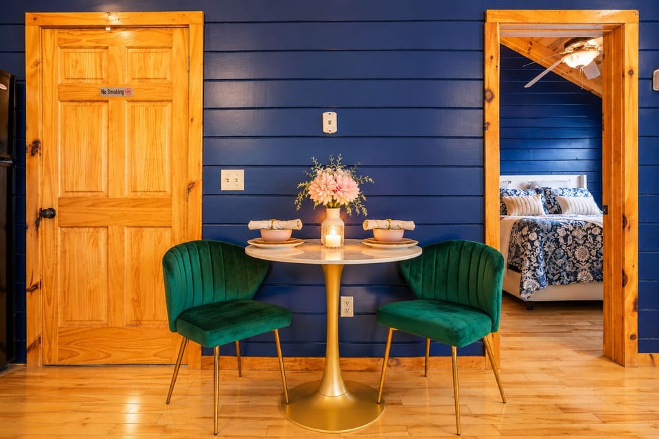 Perfect for a romantic dinner or morning coffee, this charming dining spaceoffers an intimate setting with plush velvet seating, warm cabin finishes, and thoughtful touches throughout.
