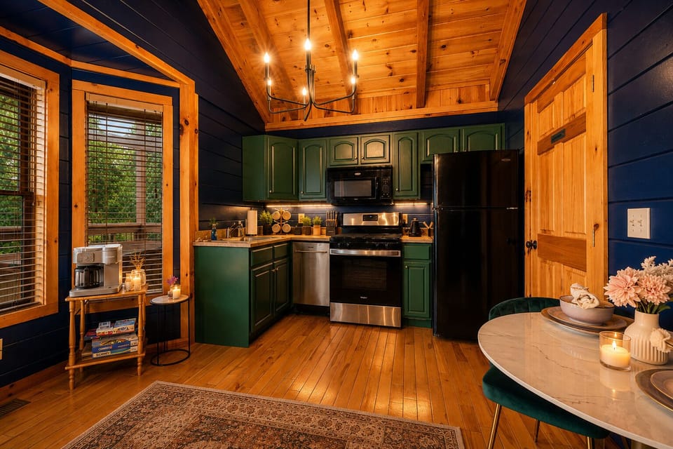 Warm and inviting, this fully equipped kitchen blends rustic cabin charm with modern convenience. Featuring rich wood accents, vibrant cabinetry, a cozy dining nook, and a dedicated coffee station, it's the perfect space that a cozy dinner.