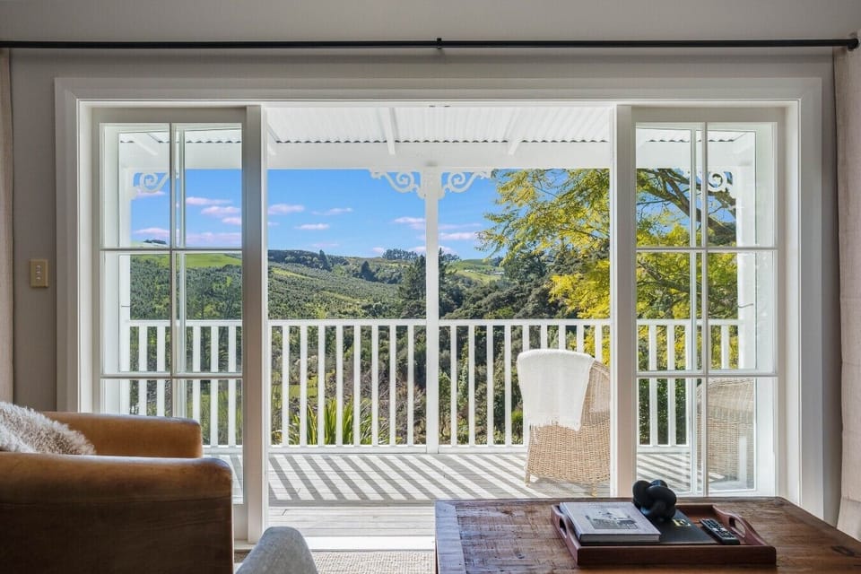 Open the doors to a private deck and far-reaching views across the countryside