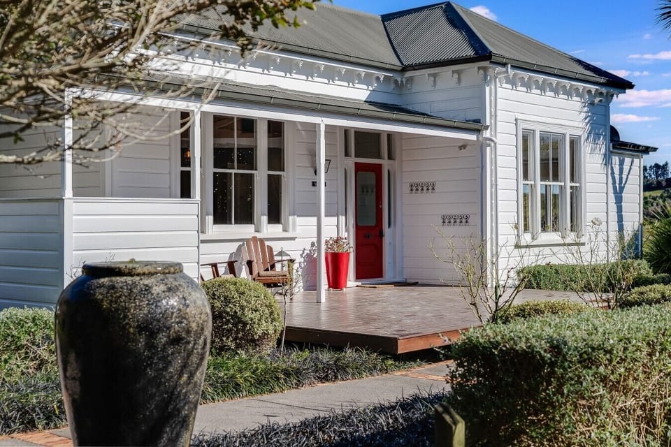 The charming villa exterior, surrounded by established gardens