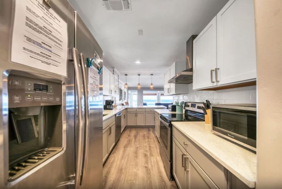 Chef's kitchen - high-quality cookware, imagine preparing meals for your group with those incredible Gulf views!