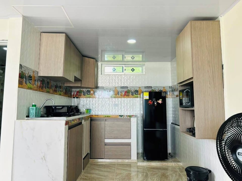Deluxe Triple Room, Sea View | Private kitchen | Full-size fridge, microwave, cookware/dishes/utensils, freezer