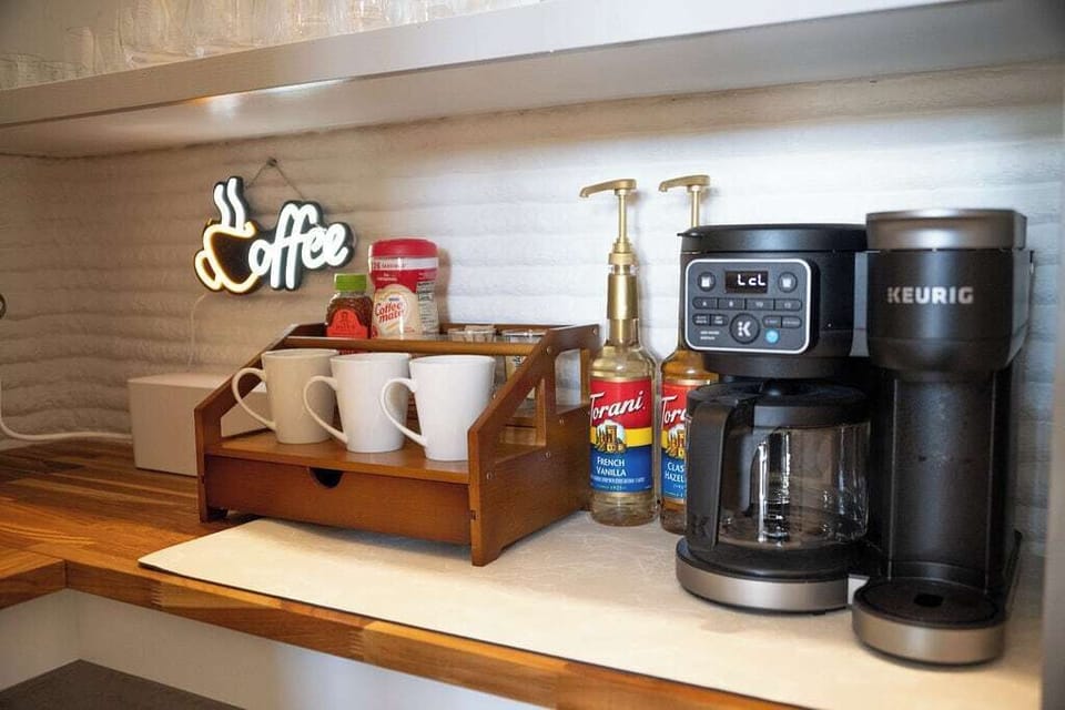 Coffee station with Keurig single/pot coffee maker.  Additional flavor options and an assortment of teas.