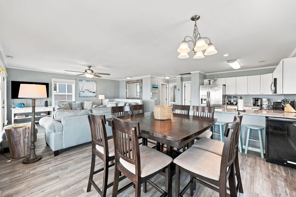 The area seamlessly bridges the gourmet kitchen and cozy living space.