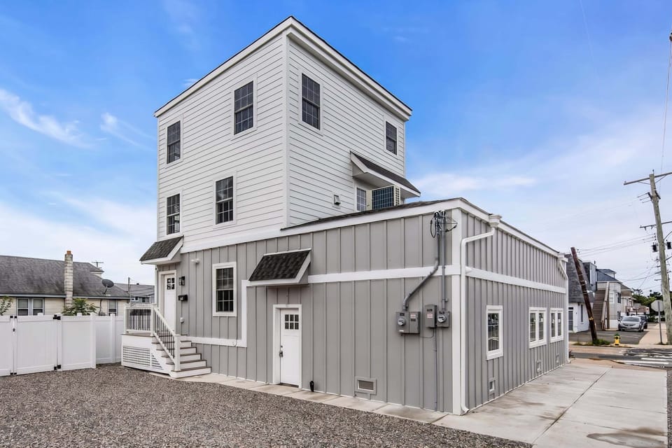 Freshly updated coastal-style exterior with private entry and clean curb appeal